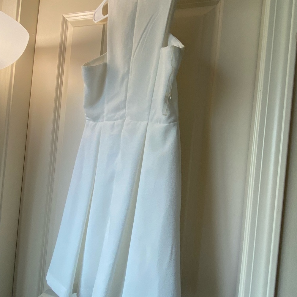White dress from Lulus. Back zipper closure.